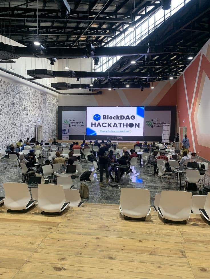 A hackathon venue with teams seated at work tables